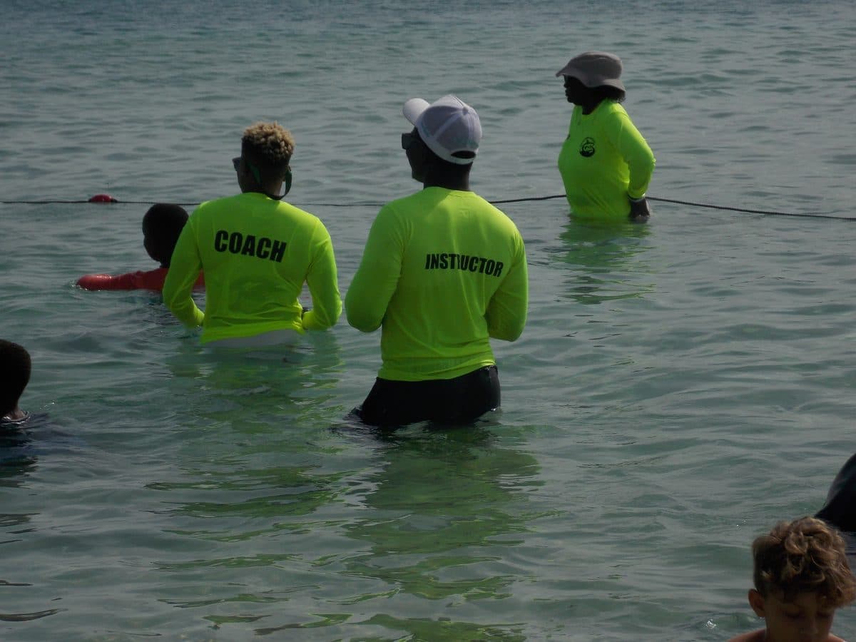 Don Shark Aquatics Sentinel overseeing swimmers in the water at Brownes Beach, Barbados