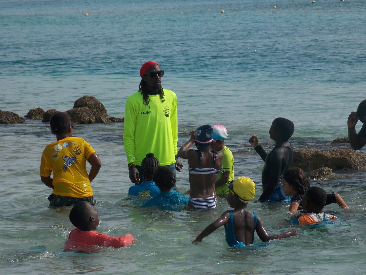 Don Shark Aquatics instructors briefing a school group on Brownes Beach